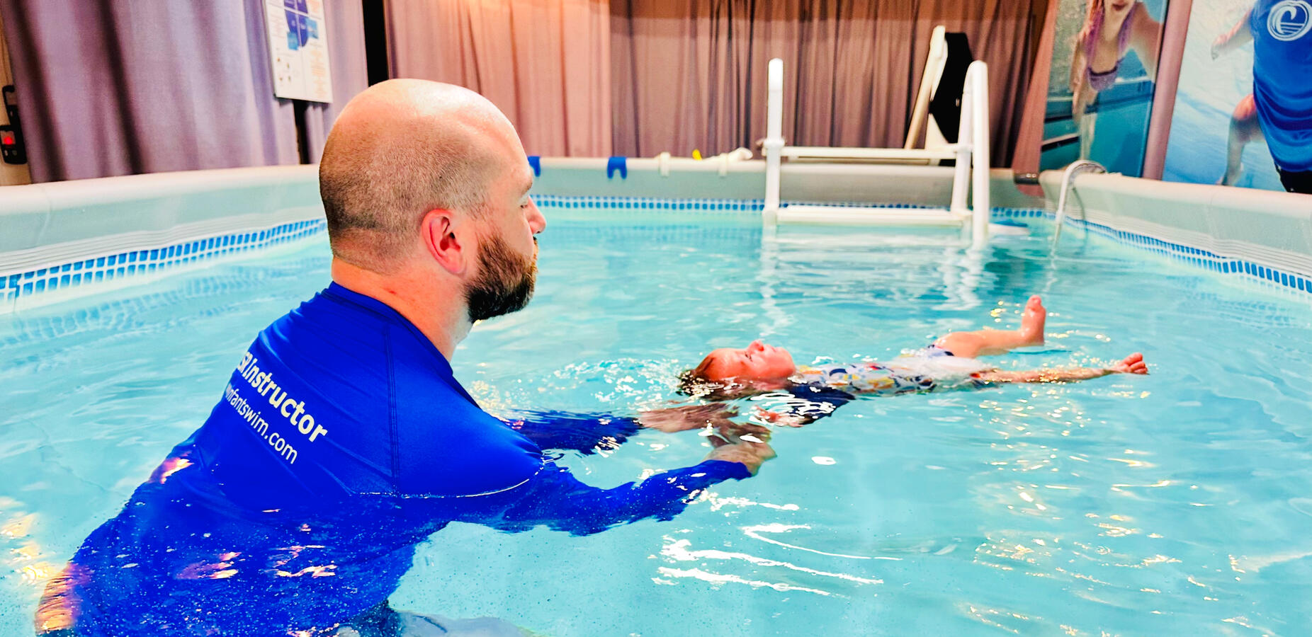 Infant floating in a pool Infant floating in a pool